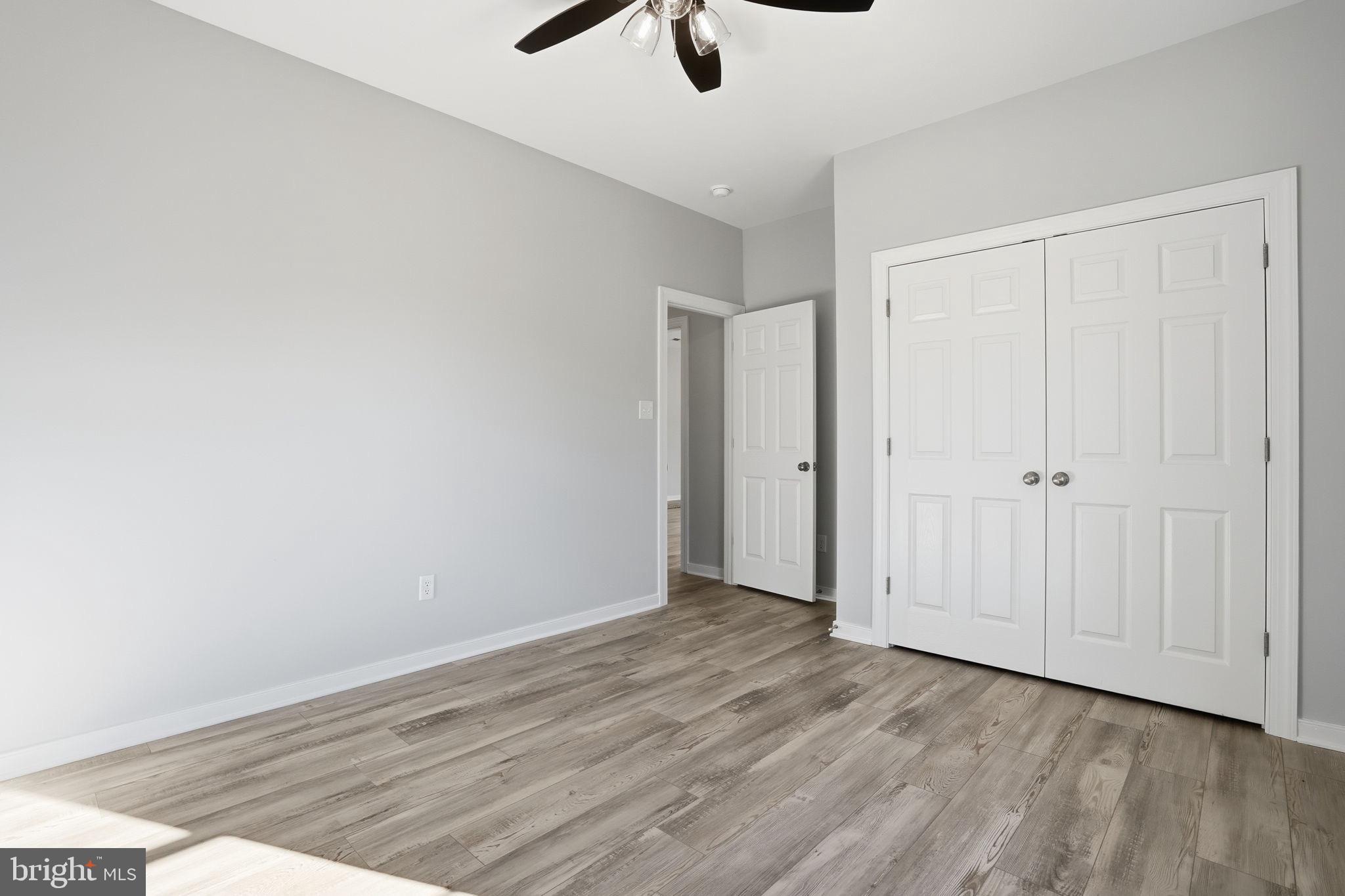 475 Fredericks Hall Road Bumpass, VA 23024 - Photo 31 of 44 a view of an empty room with wooden floor