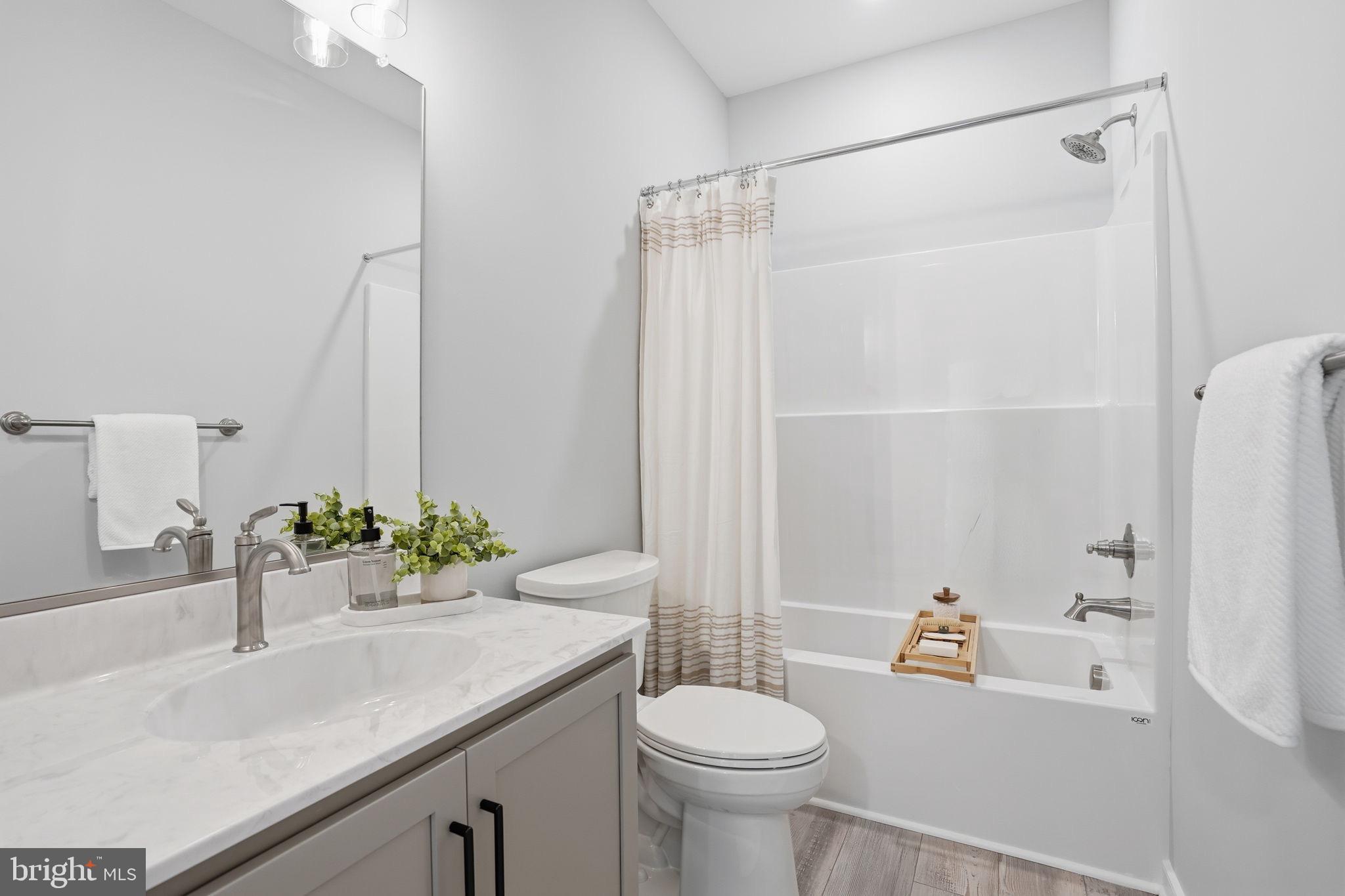 475 Fredericks Hall Road Bumpass, VA 23024 - Photo 32 of 44 a bathroom with a sink toilet and shower