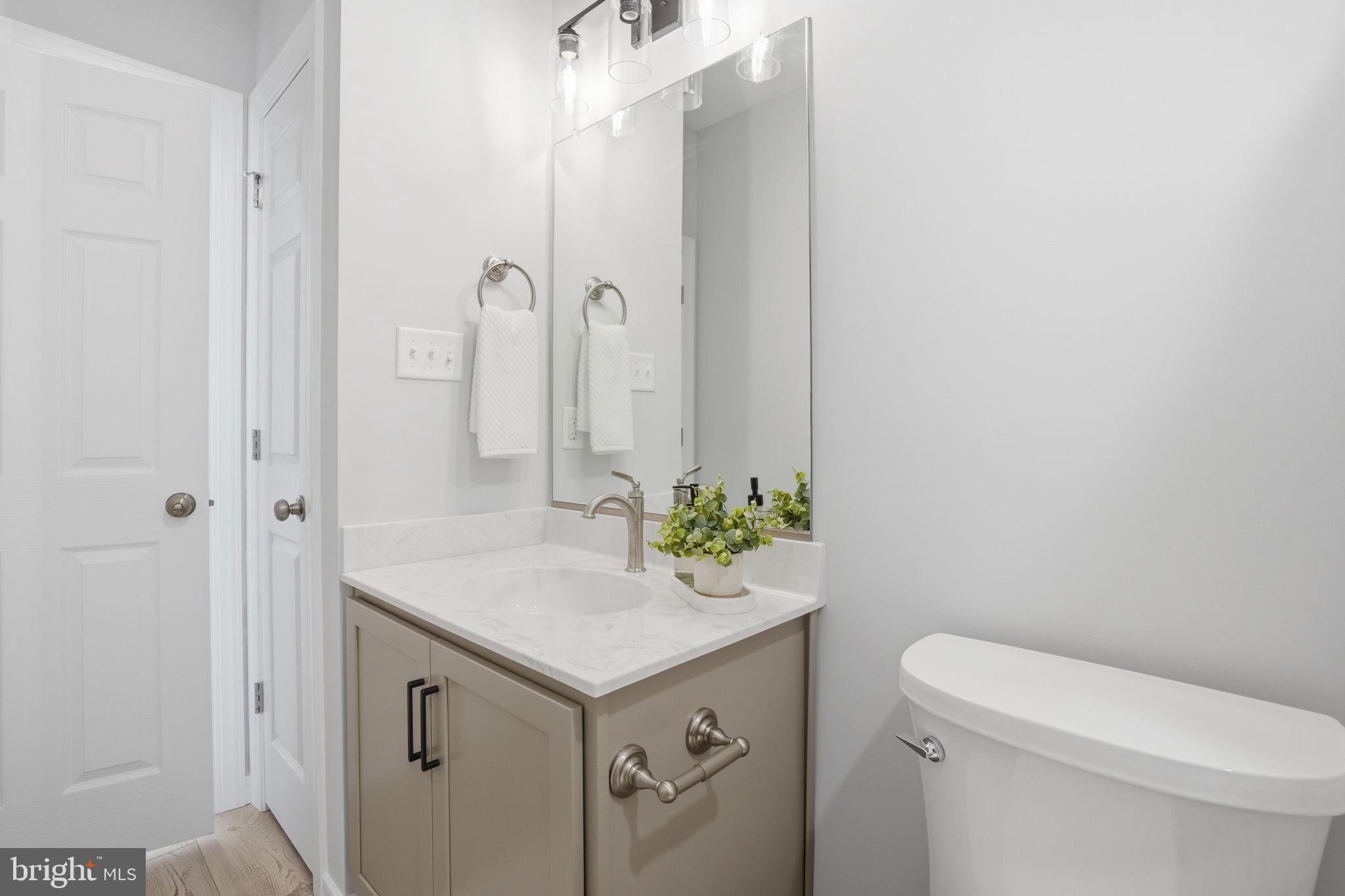 475 Fredericks Hall Road Bumpass, VA 23024 - Photo 33 of 44 a bathroom with a sink a toilet and shower