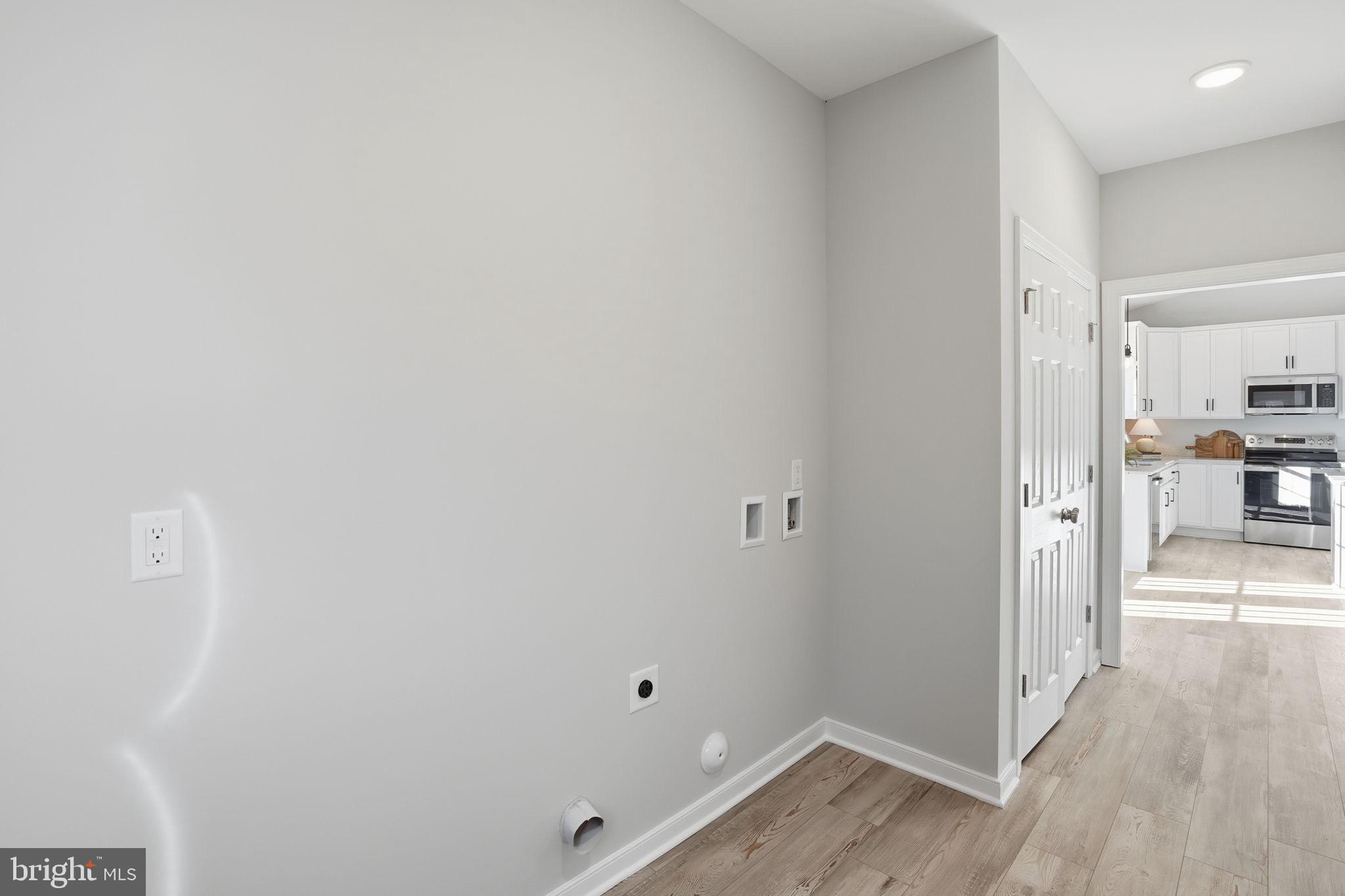 475 Fredericks Hall Road Bumpass, VA 23024 - Photo 34 of 44 a view of a hallway with wooden floor