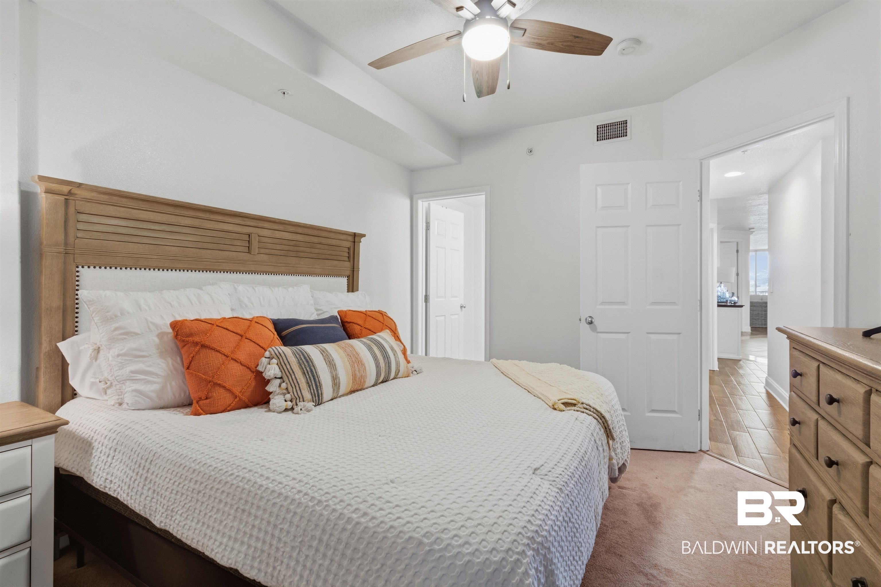 3564 Bayou Road, Unit 203 Orange Beach, AL 36561 - Photo 27 of 53 Inviting bedroom with light-colored carpeting and a ceiling fan