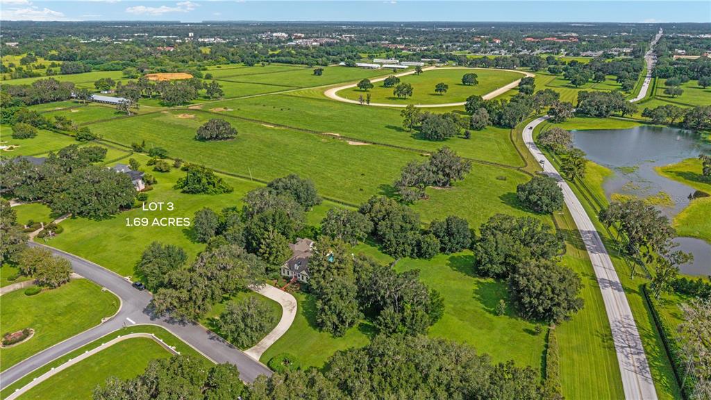 0 Southwest 53rd Street Ocala, FL 34471 - Photo 2 of 5 an aerial view of residential houses with outdoor space and lake view