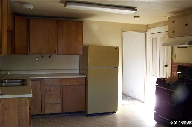 4 Foothill Road Woodfords, CA 96120 - Photo 8 of 13 a kitchen with a refrigerator and a stove
