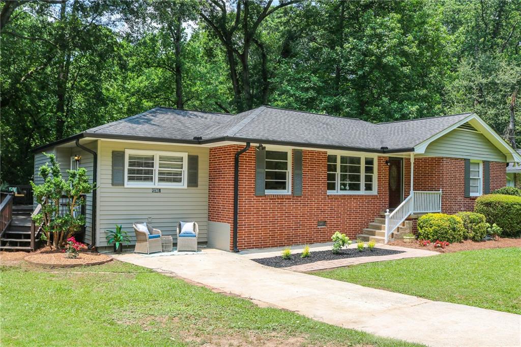 2365 Harrington Drive Decatur, GA 30033 - Photo 1 of 1 a front view of a house with a yard and trees