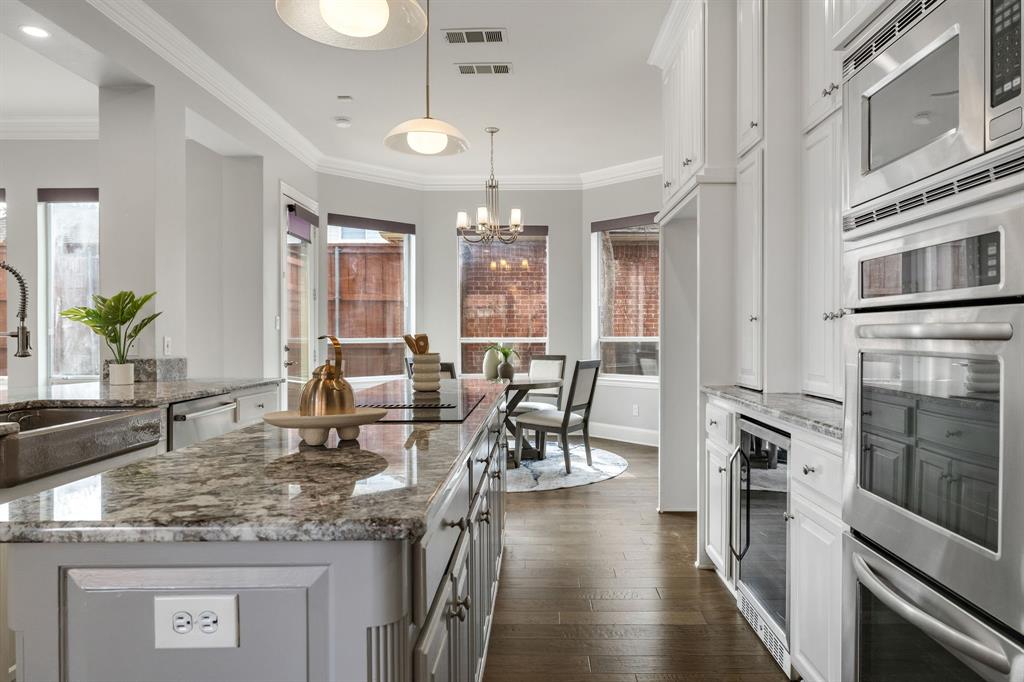 4512 Banyon Lane Dallas, TX 75287 - Photo 15 of 40 4512 Banyan Ln-Kitchen with adjoining sunlit breakfast nook by Fang Underhill.
