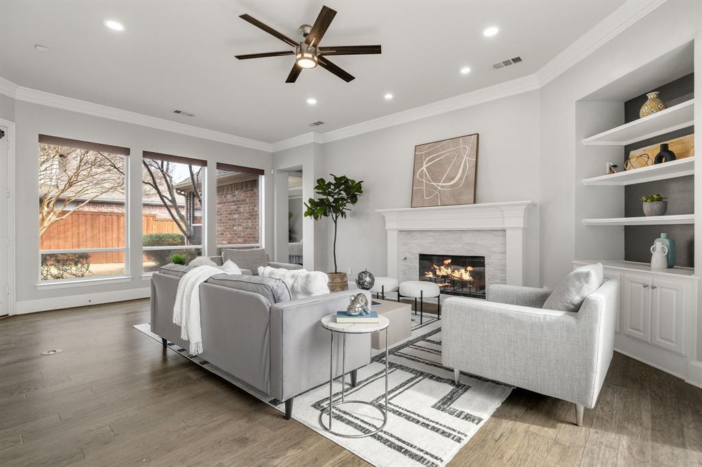 4512 Banyon Lane Dallas, TX 75287 - Photo 20 of 40 4512 Banyan Ln-Conform meets connection with backyard views, a focal fireplace, and seamless access to the kitchen by Fang Underhill.