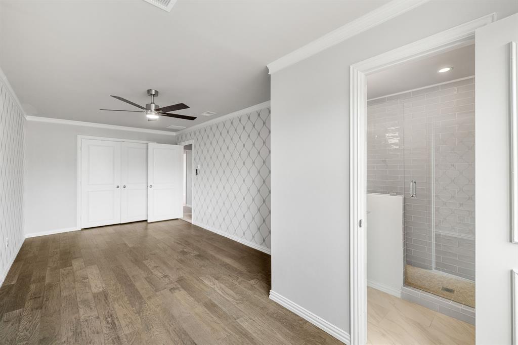 4512 Banyon Lane Dallas, TX 75287 - Photo 34 of 40 4512 Banyan Ln-Upstairs bedroom#3 with ensuite bath with walk in shower and single vanity by Fang Underhill.