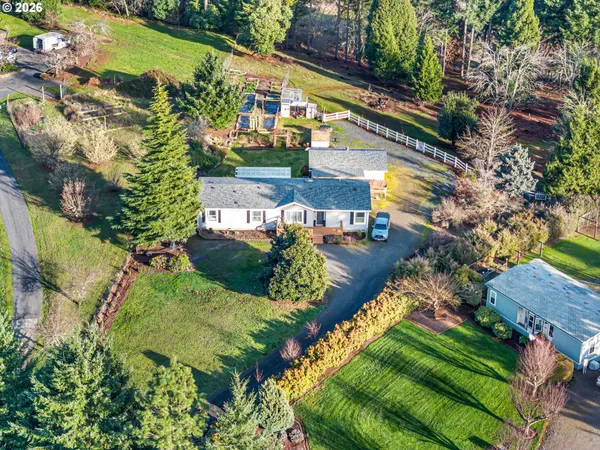 an aerial view of a house with a garden