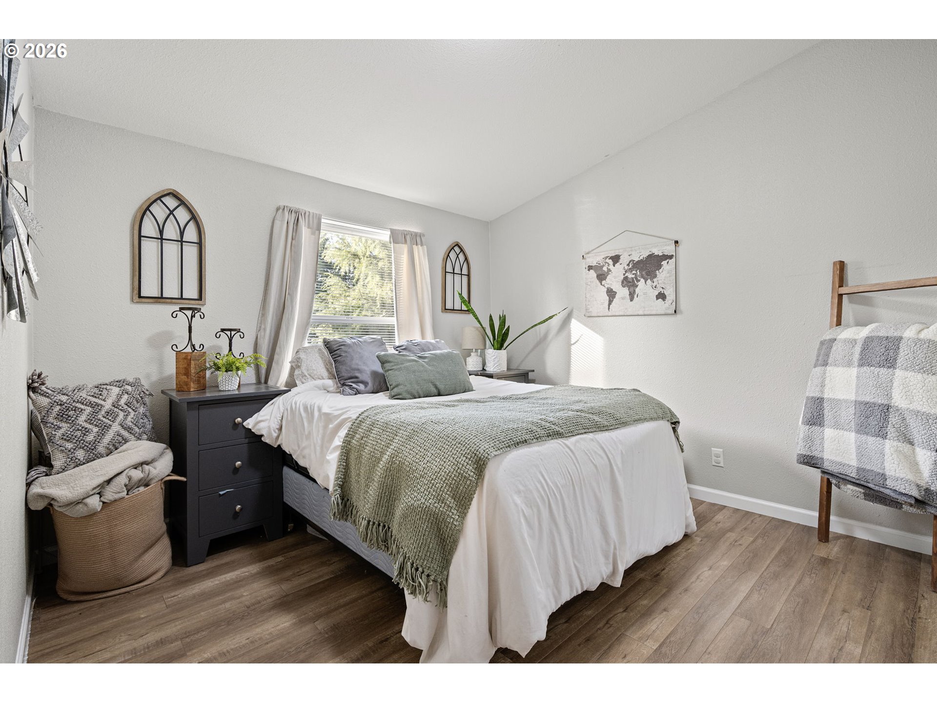 83149 Mickelson Road Creswell, OR 97426 - Photo 15 of 34 a bedroom with a bed and wooden floor