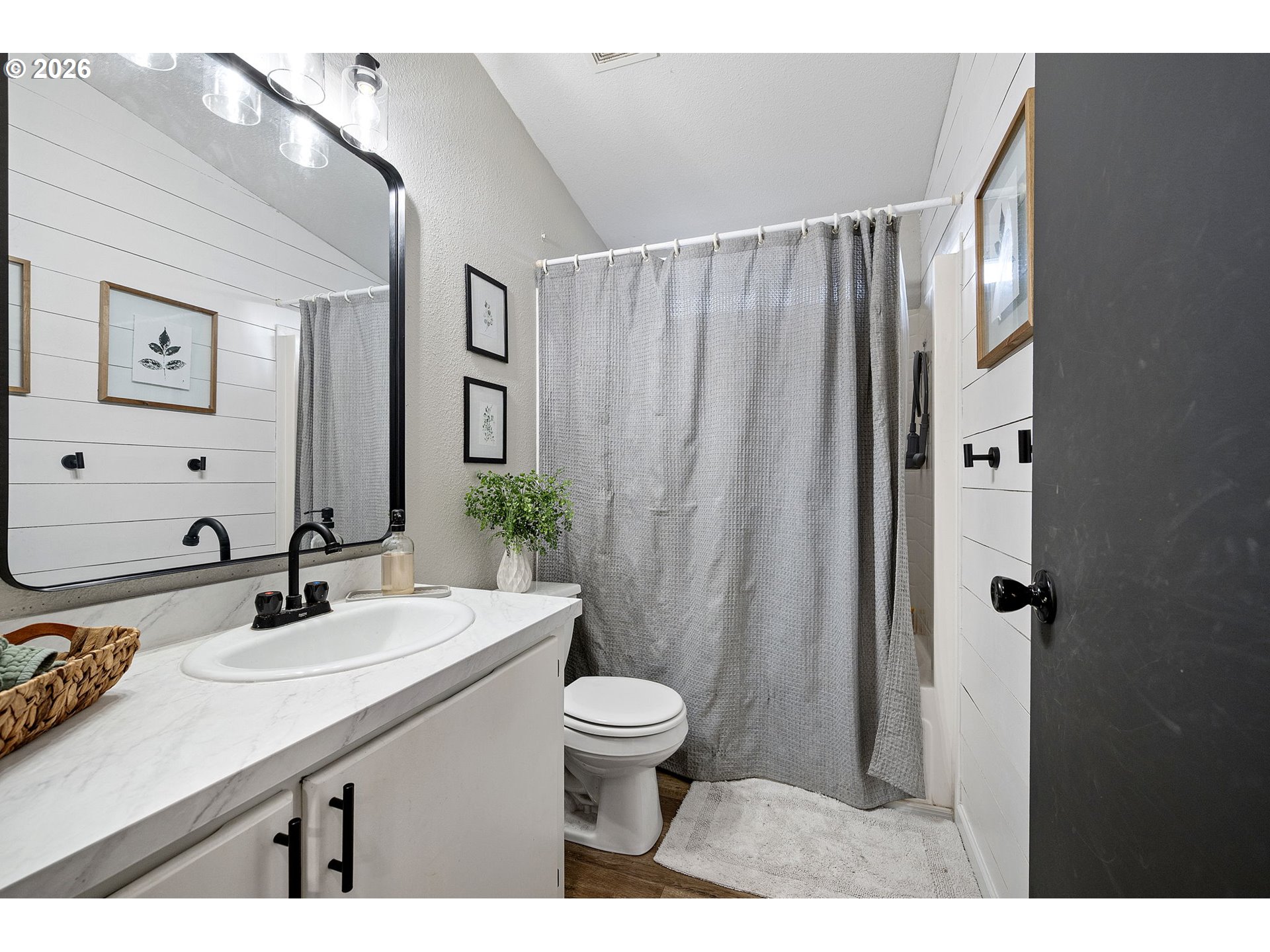 83149 Mickelson Road Creswell, OR 97426 - Photo 17 of 34 a bathroom with a sink a toilet a mirror and shower curtain