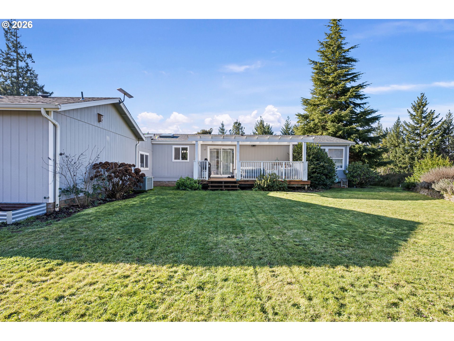 83149 Mickelson Road Creswell, OR 97426 - Photo 22 of 34 a view of a house with a backyard