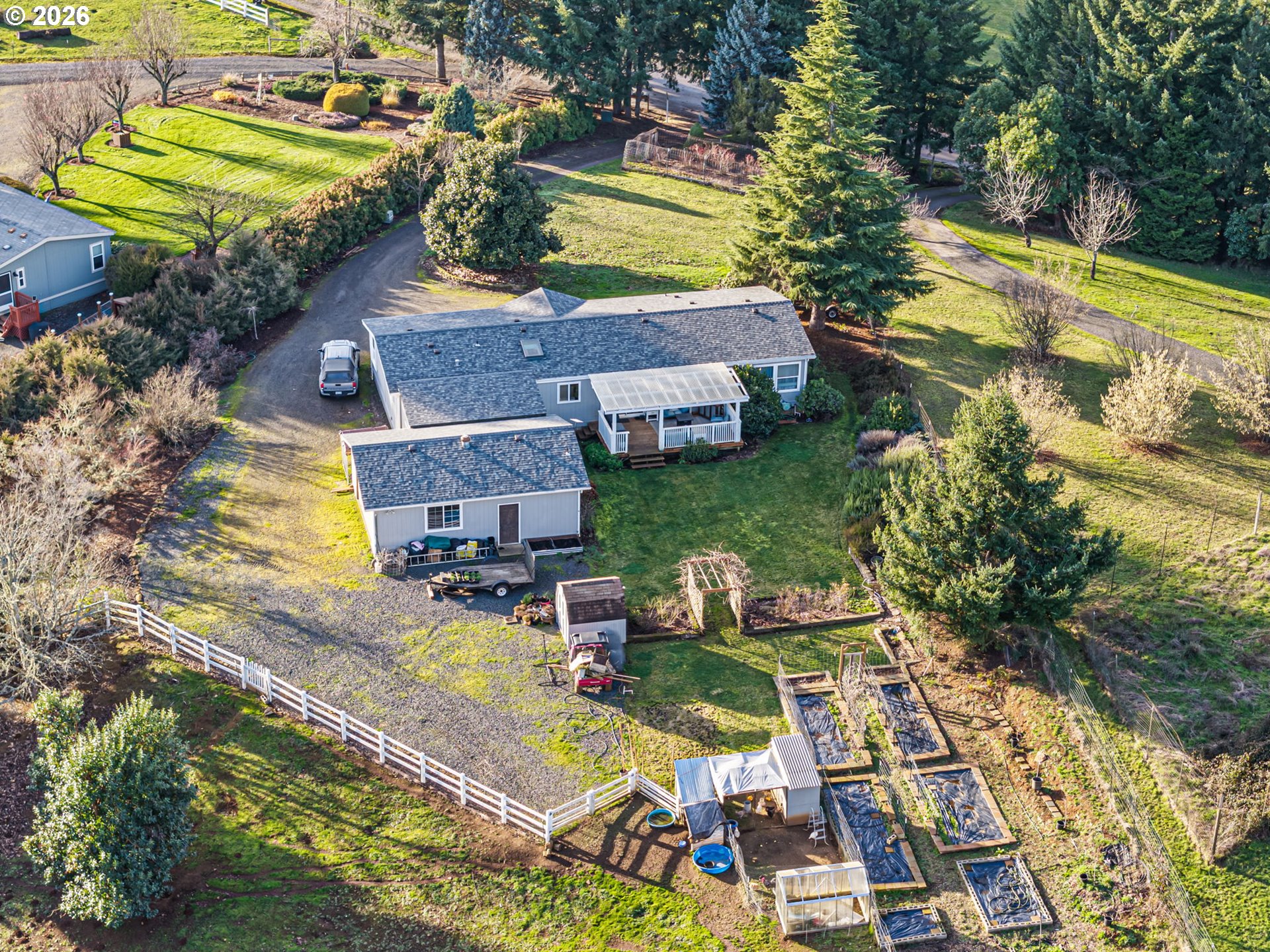 83149 Mickelson Road Creswell, OR 97426 - Photo 32 of 34 an aerial view of a house with a garden and swimming pool