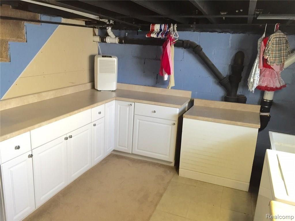36769 Goddard Road Romulus, MI 48174 - Photo 33 of 34 Large laundry area with cabinets/storage