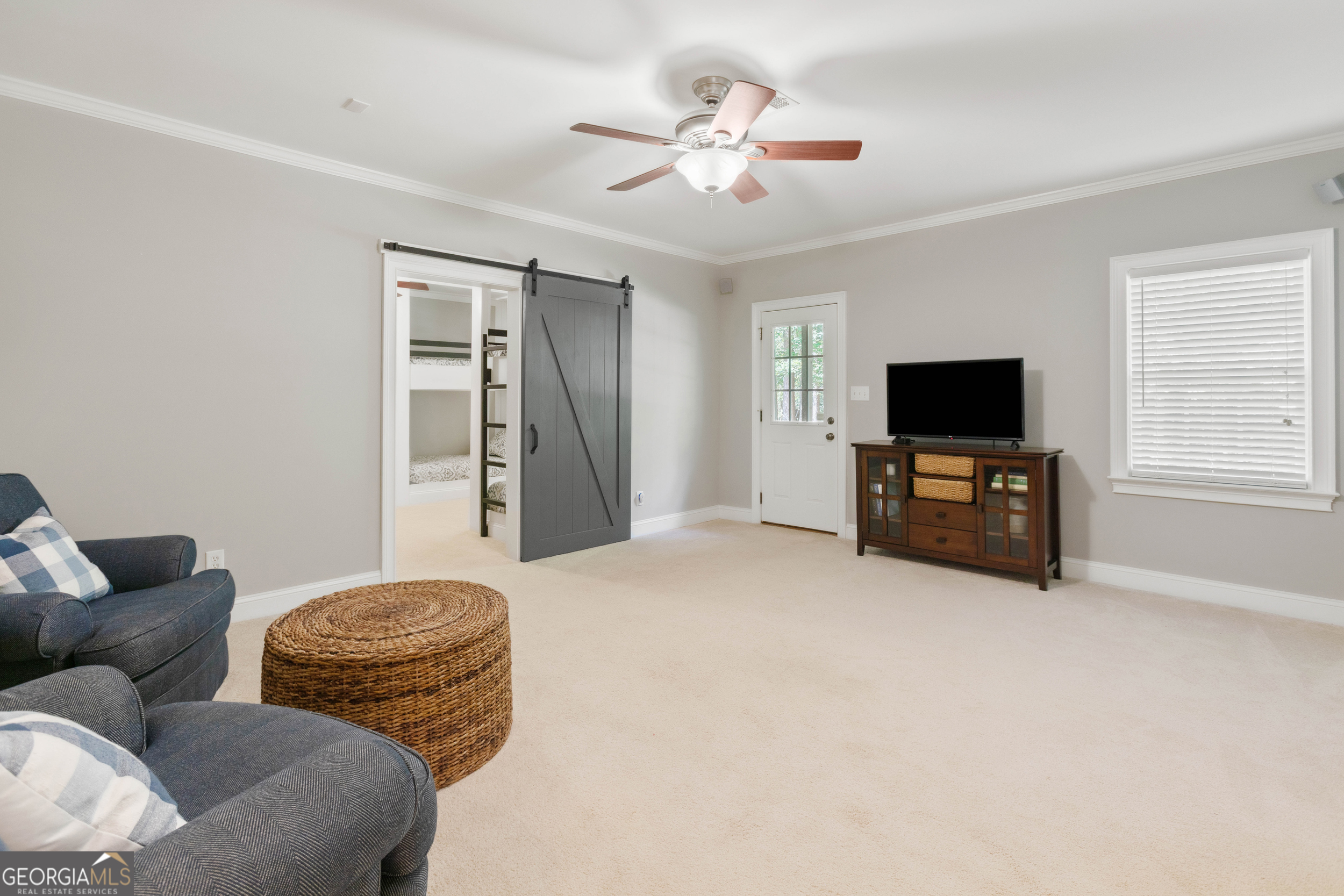 1030 Spring Lake Drive Bishop, GA 30621 - Photo 39 of 53 a living room with furniture and a flat screen tv