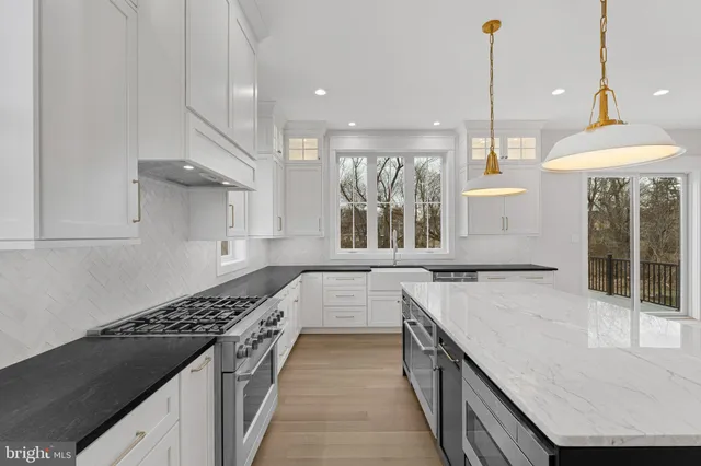 a kitchen with a stove and a sink