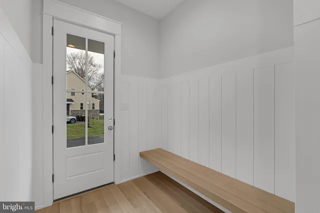 a view of room with window and wooden floor