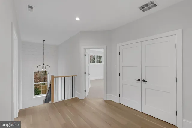 a view of a hallway with closet area