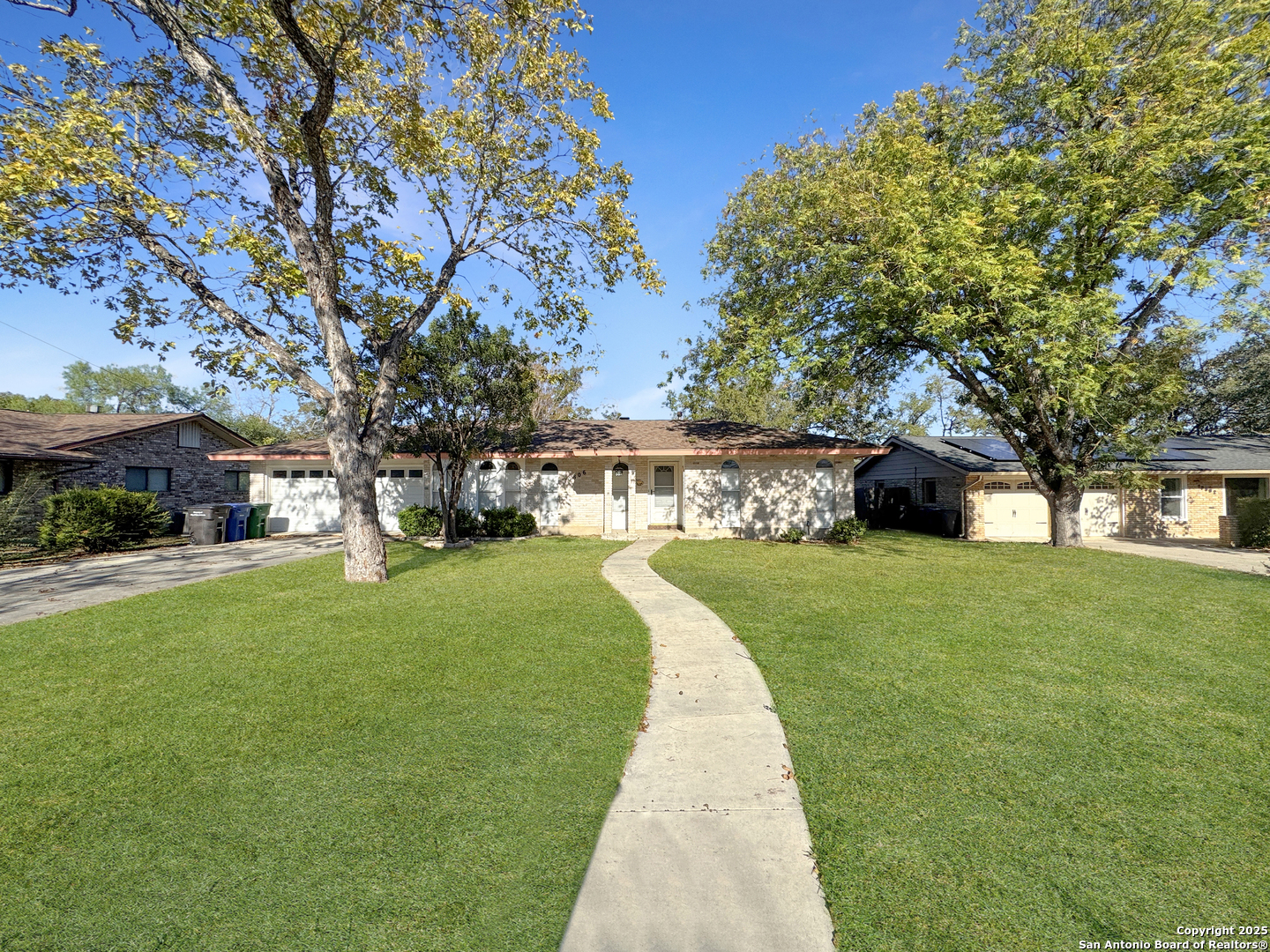 10806 Mount Tipton San Antonio, TX 78213 - Photo 1 of 22 a front view of a house with a yard