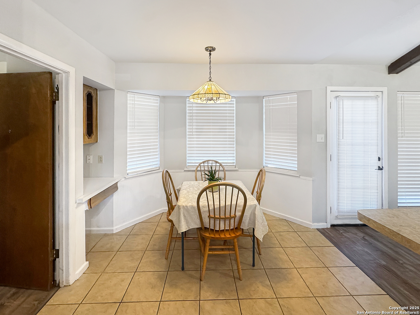 10806 Mount Tipton San Antonio, TX 78213 - Photo 13 of 22 a dining room with furniture and window