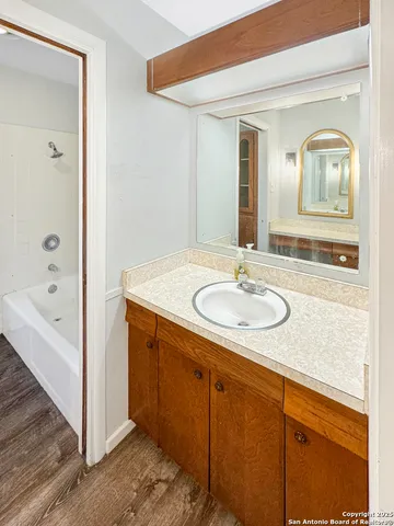a bathroom with a sink double vanity and a mirror