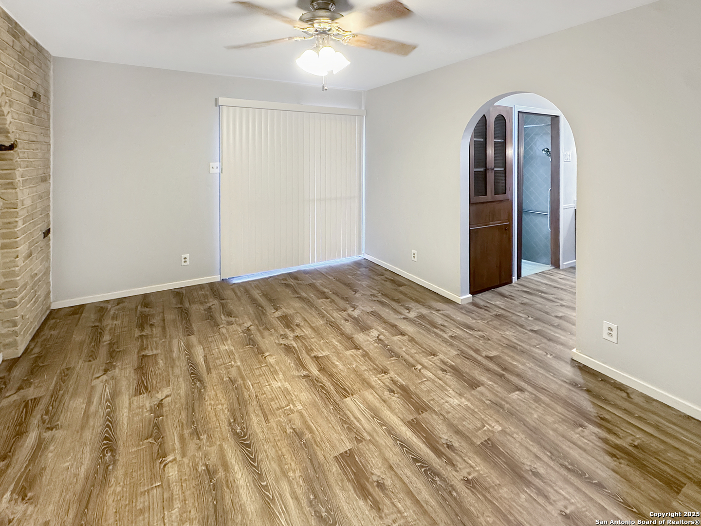 10806 Mount Tipton San Antonio, TX 78213 - Photo 20 of 22 a view of an empty room with a chandelier fan