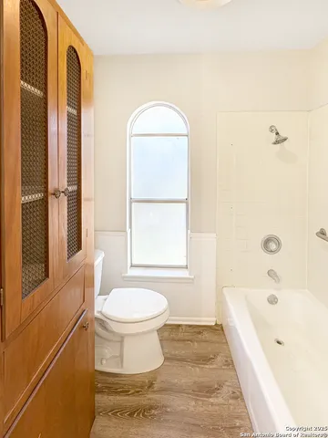 a bathroom with a bathtub sink and toilet