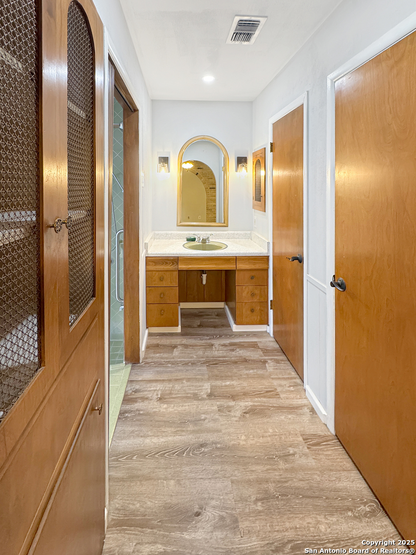 10806 Mount Tipton San Antonio, TX 78213 - Photo 10 of 22 a spacious bathroom with a sink and a mirror