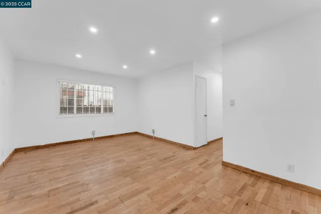 a view of an empty room with windows