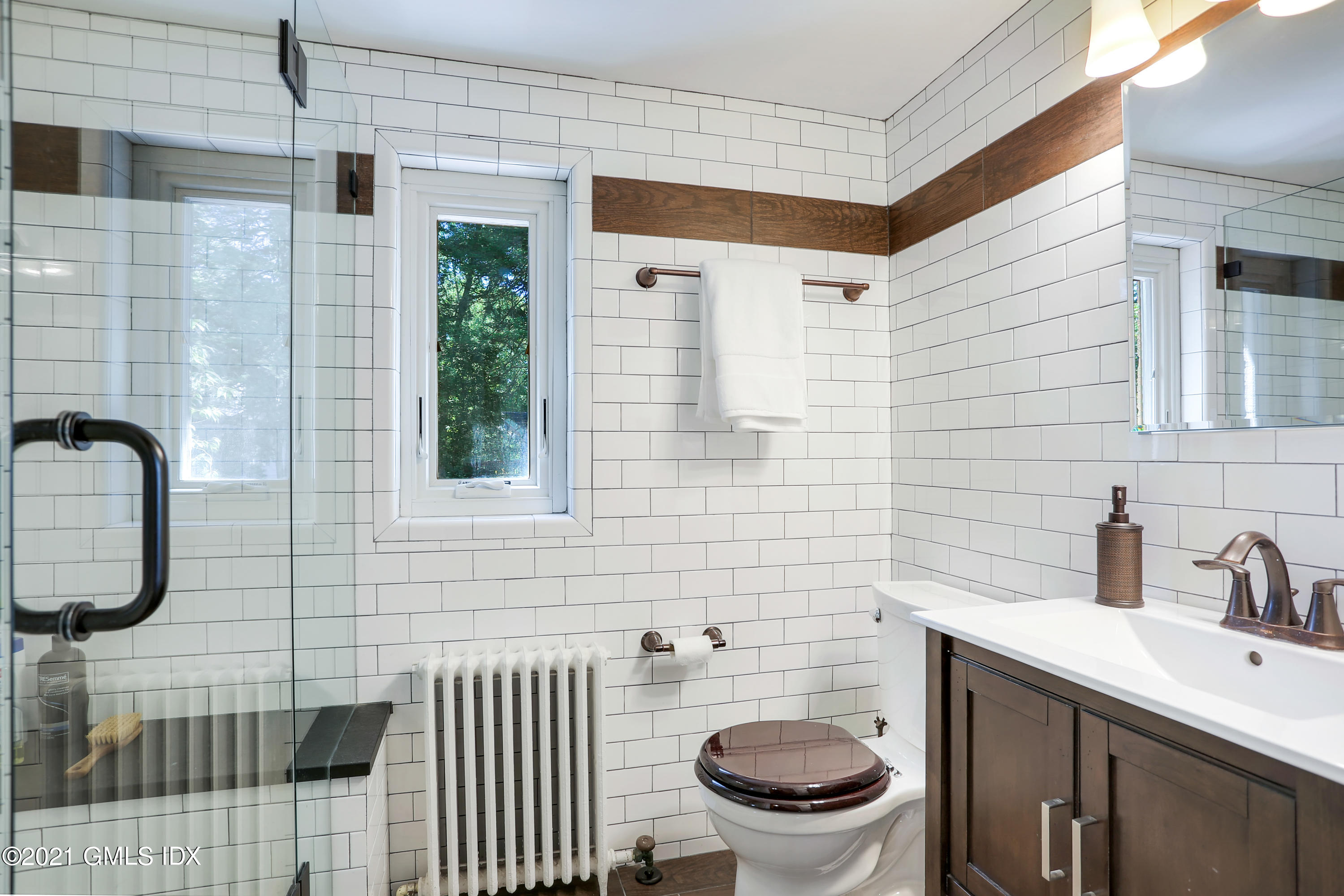 44 Summit Road Riverside, CT 06878 - Photo 14 of 28 a bathroom with a toilet sink and mirror