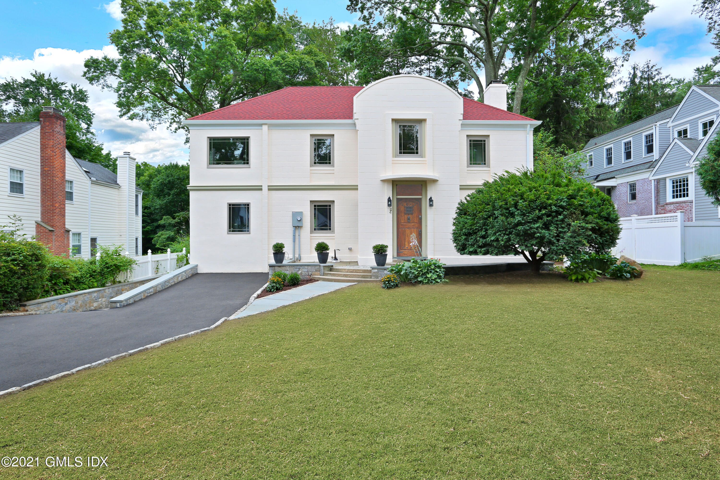 44 Summit Road Riverside, CT 06878 - Photo 24 of 28 a view of a white house with a yard