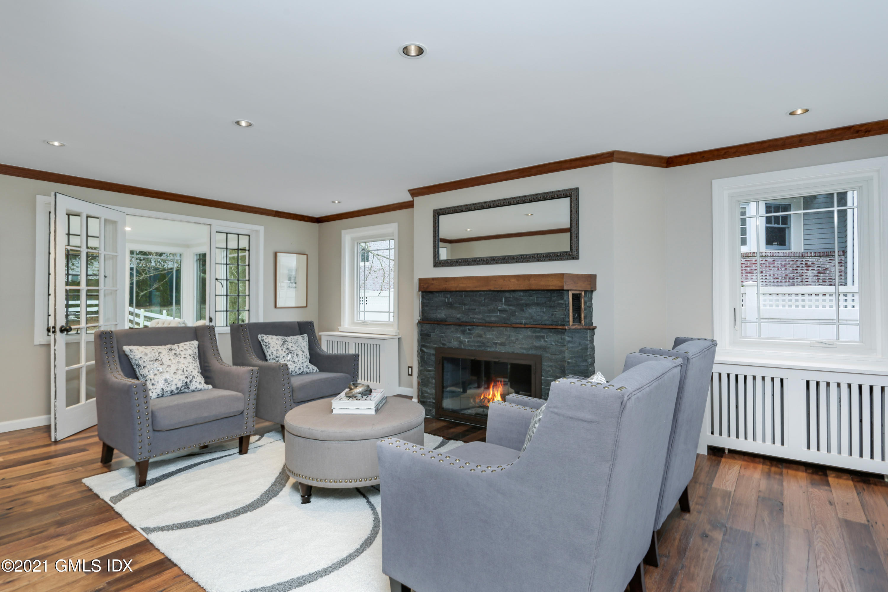 44 Summit Road Riverside, CT 06878 - Photo 3 of 28 a living room with furniture and a fireplace