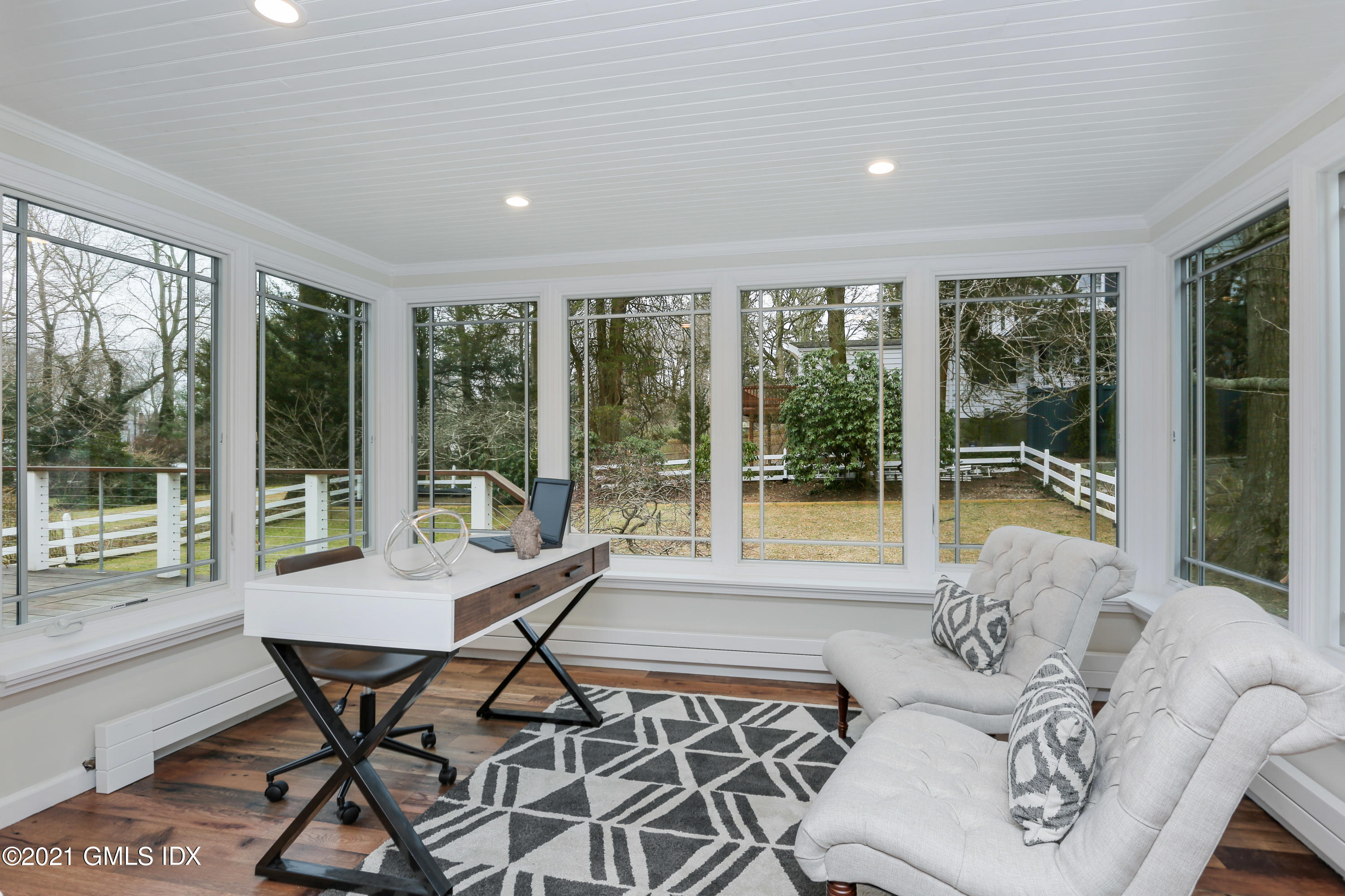 44 Summit Road Riverside, CT 06878 - Photo 6 of 28 a dining room with furniture large windows and wooden floor