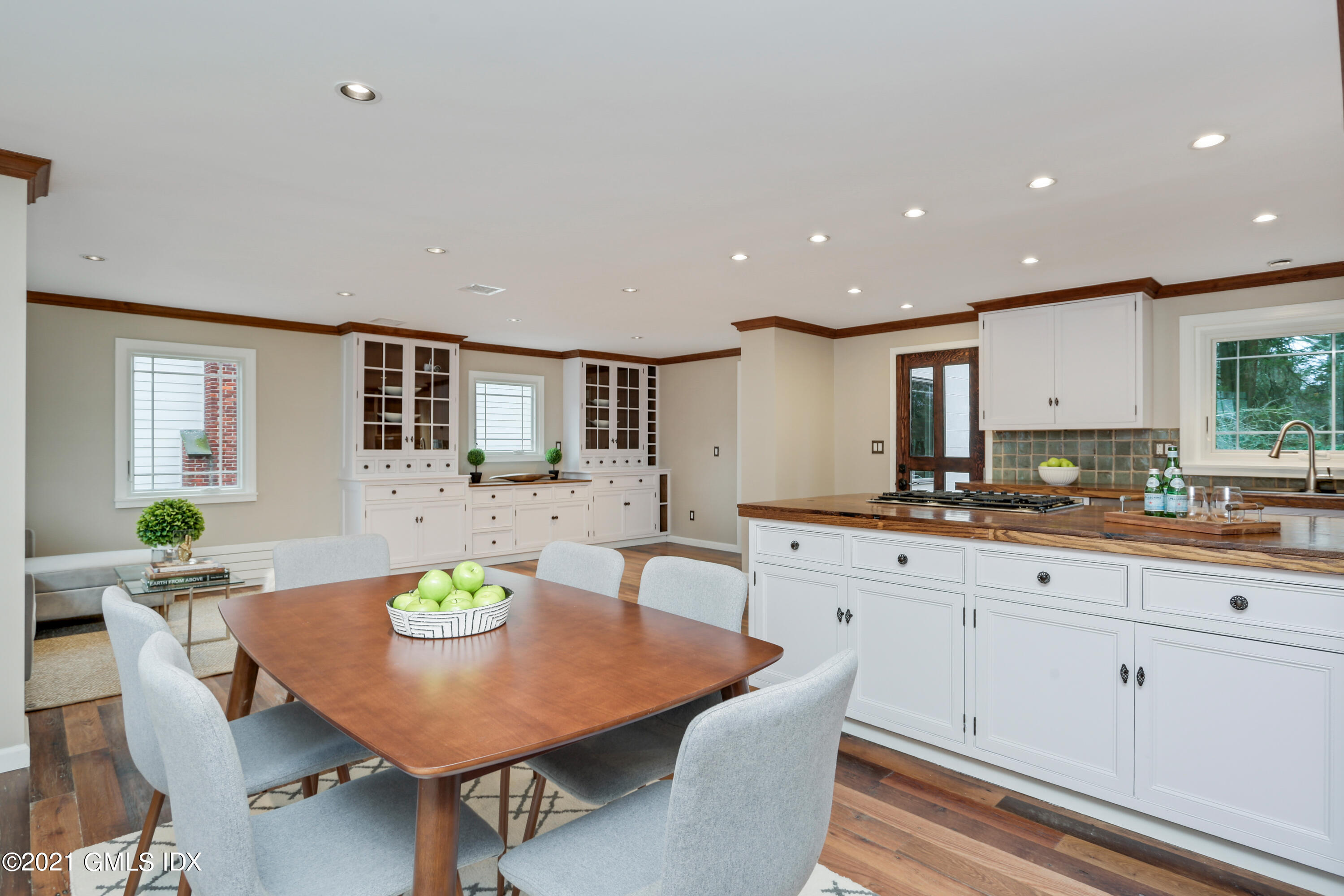 44 Summit Road Riverside, CT 06878 - Photo 7 of 28 a kitchen with a table and chairs in it