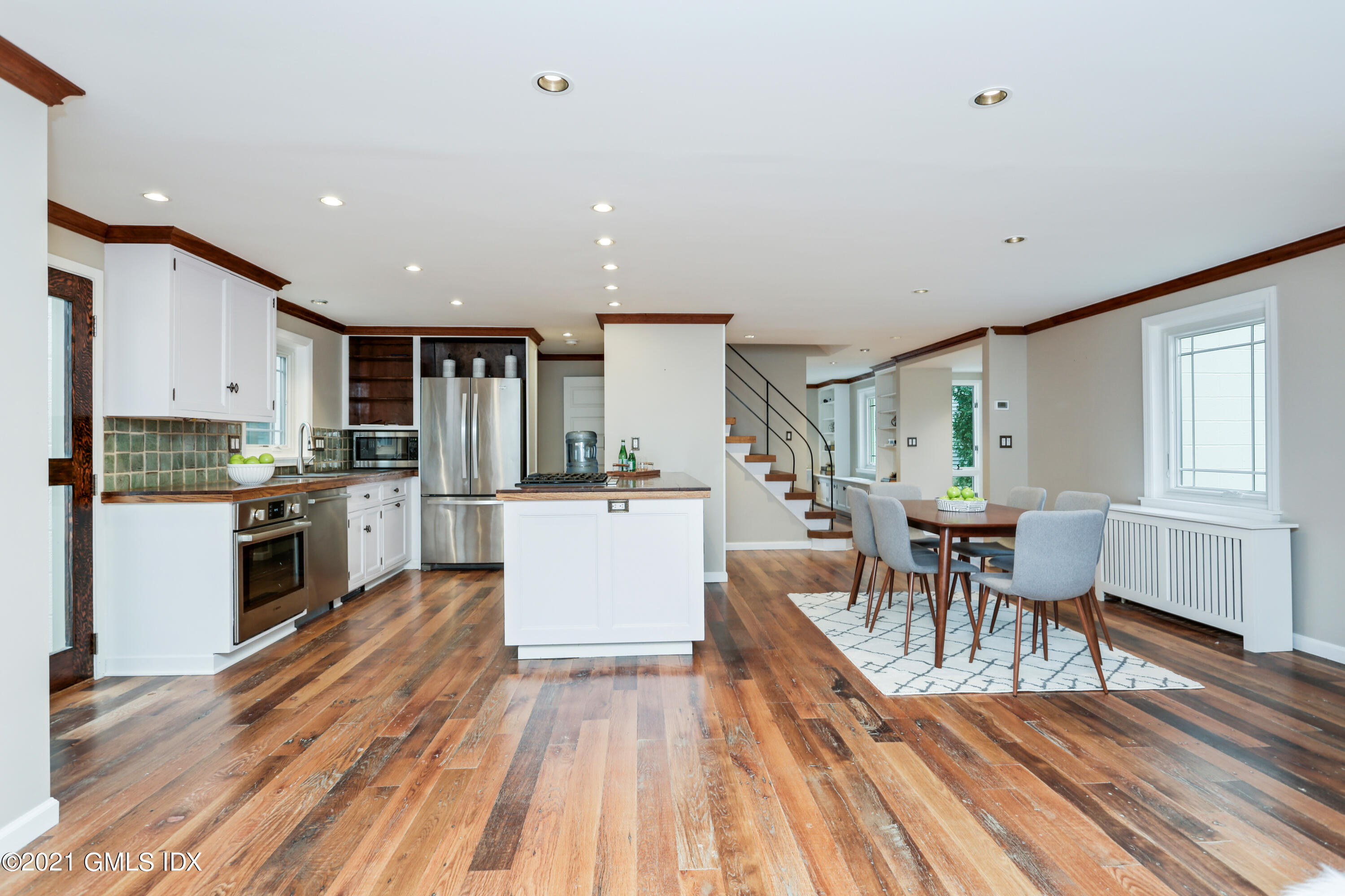 44 Summit Road Riverside, CT 06878 - Photo 8 of 28 a open kitchen with white cabinets and stainless steel appliances