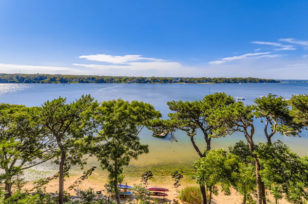 217 Barnes Road Oak Bluffs, MA 02557 - Photo 56 of 60 a view of a lake from a yard