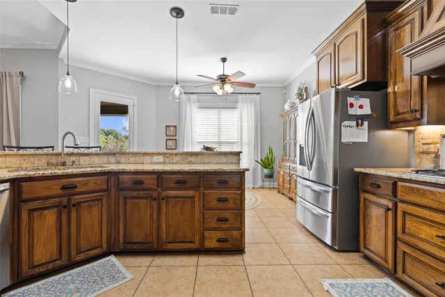 a kitchen with a sink stove and refrigerator