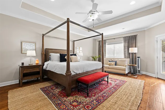 a bedroom with a bed a table and chair