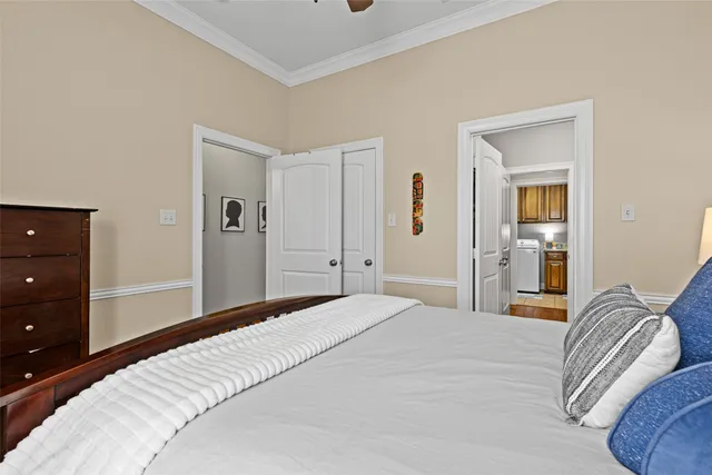 a bedroom with a bed and a lamp