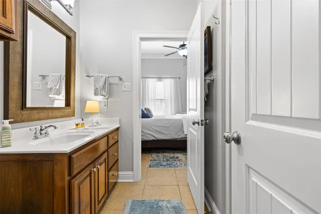 a en suite bathroom with a sink a mirror and a shower