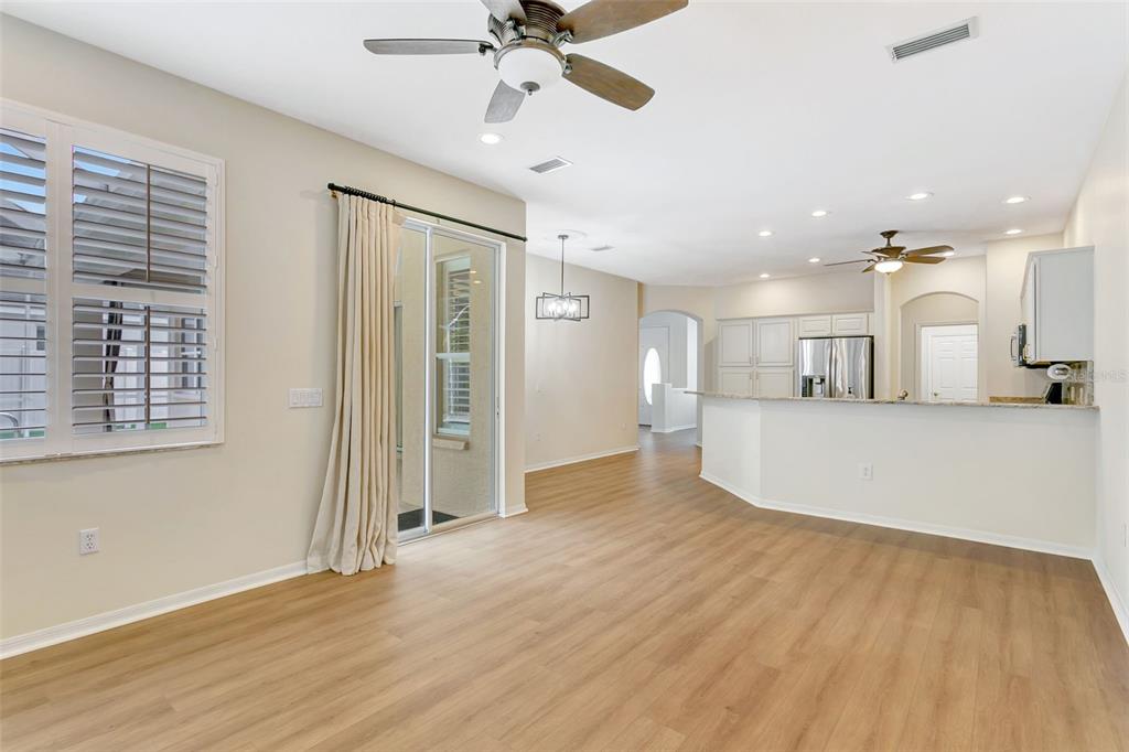 11209 Pine Lilly Place Lakewood Ranch, FL 34202 - Photo 12 of 26 a view of a kitchen with a sink and a window