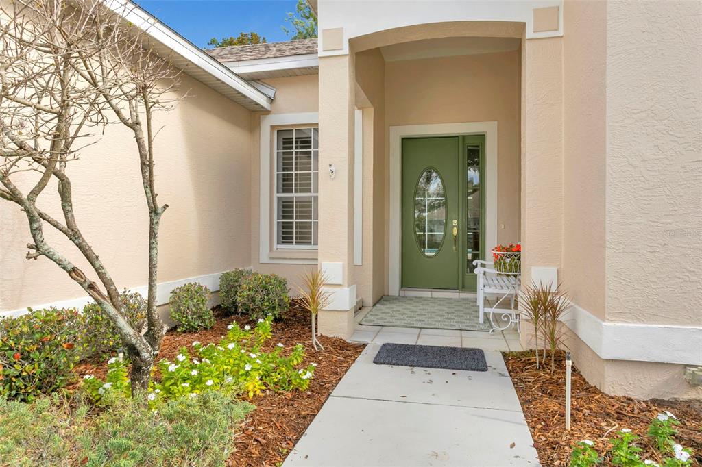 11209 Pine Lilly Place Lakewood Ranch, FL 34202 - Photo 2 of 26 a porch with seating space