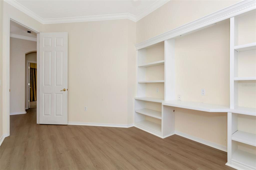 11209 Pine Lilly Place Lakewood Ranch, FL 34202 - Photo 21 of 26 a view of a room with wooden floor and closet