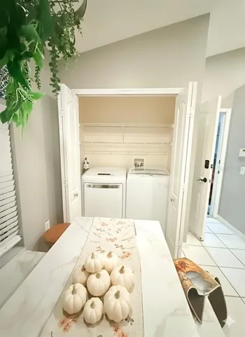 a large bed sitting in a bedroom next to a window