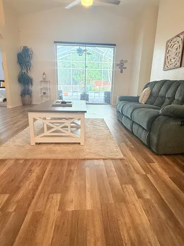 a bed sitting in a room next to a window