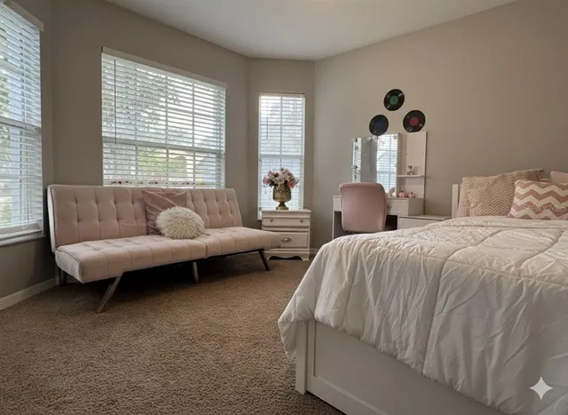 a bedroom with a bed and window