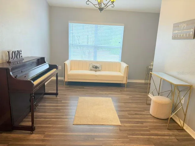 a living room with fireplace furniture and a flat screen tv