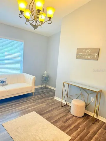 a spacious bedroom with two beds and a large window