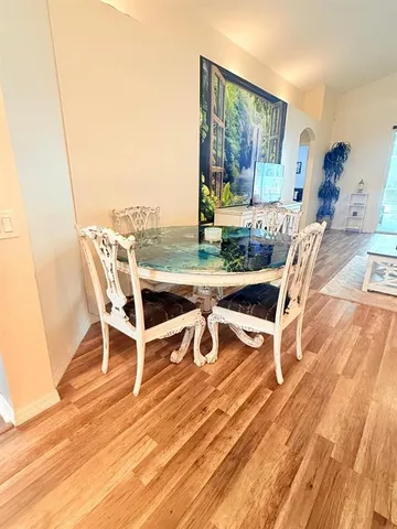 a spacious bedroom with two beds and a large window