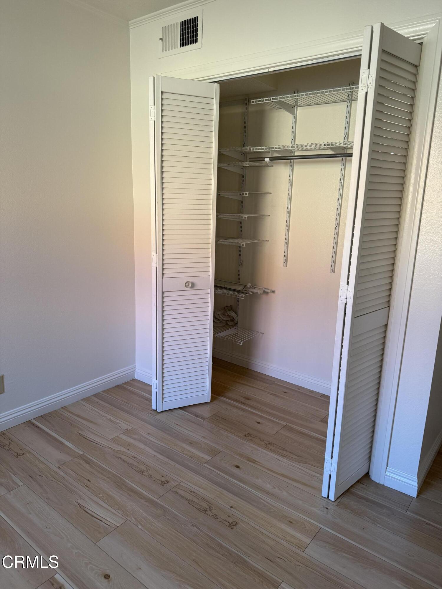 108 North Chapel Avenue, Unit 5 Alhambra, CA 91801 - Photo 19 of 30 an empty room with wooden floor and entrance