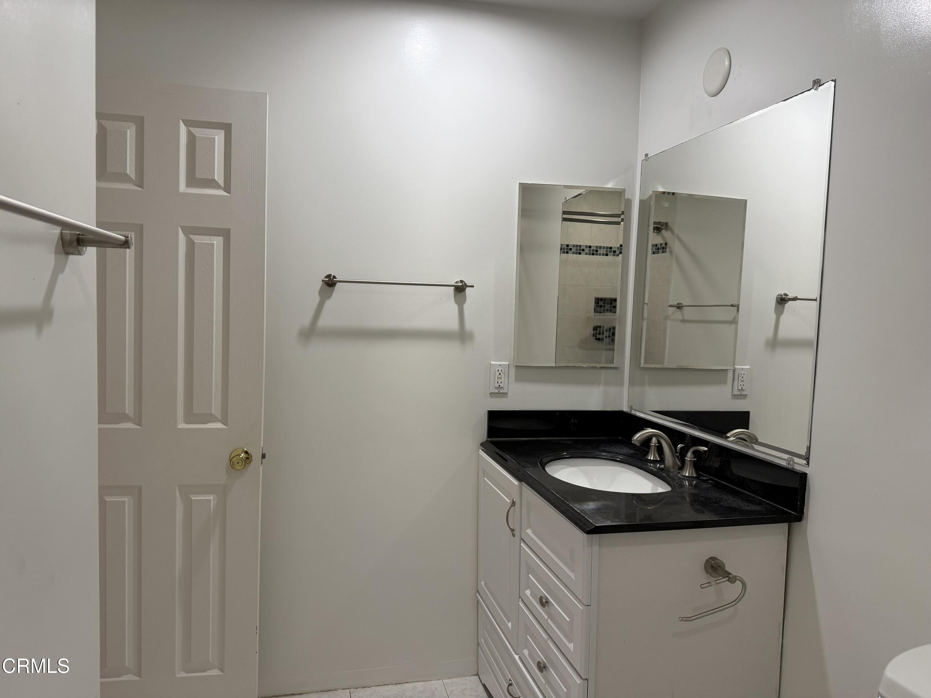 108 North Chapel Avenue, Unit 5 Alhambra, CA 91801 - Photo 22 of 30 a sink and a mirror